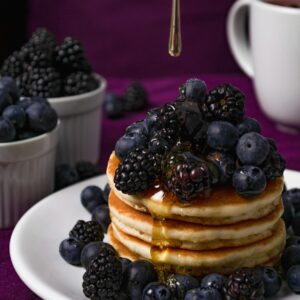 Pancakes With Black Berries on White Ceramic Plate